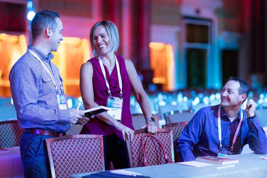 Attendees-networking-at-event-woman-laughing